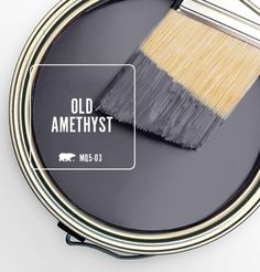 an old amethyst paint can with a brush on it and the words learn more below