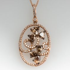 This gorgeous Carlo Viani necklace is crafted of 14k rose gold and features a floral diamond motif. The pendant is set with 6 fancy brown pear cut diamonds, 2 fancy brown round brilliant diamonds, and 94 smaller round brilliant accent diamonds. The total diamond weight is 1.89 carats. The pendant is in excellent condition and hangs from a 14k rose gold 18-inch chain. Ask us about a matching Carlo Viani ring. Luxury Brown Jewelry With Brilliant Cut, Luxury Brown Jewelry With Diamond Accents, Elegant Brown Oval Jewelry, Elegant Oval Brown Jewelry, Elegant Brown Necklace For Anniversary, Elegant Brown Oval Pendant Necklace, Floral Pendant Necklace, Pear Cut Diamond, Floral Pendant