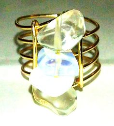 This very special and unique ring is an eye catcher. The setting consists of four opalite stones closed with gold toned copper. Comfortable fit. Goes with any attire. The ring fits U.S. size 5.5 to 6. The is a ring fit for any attire. It can be used as a stackable statement ring. Gold Wire Ring, Opal Statement Ring, Jewelry Opal, Wire Ring, Ring Opal, Wire Rings, Ring Fit, Unique Ring, Gold Wire