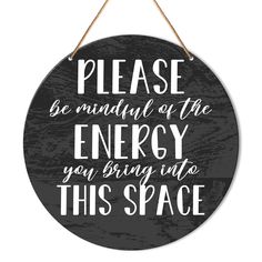 a sign that says please be mindful of the energy you bring into this space