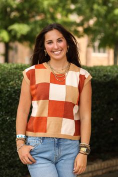 Our "Erin Colorblock Top (Brown Multi)" is a rust colored vest with different shades of orange and brown. It is a super soft material and perfect for back to school! Our model is wearing a size Small. Trendy Brown Sweater Vest For Layering, Casual Brown Vest For Fall, Brown Vest For Layering In Fall, Brown Vest For Fall Layering, Casual Patchwork Sleeveless Sweater Vest, Brown Sweater Vest For Layering, Trendy Brown Vest For Fall, Casual Brown Vest For Layering, Brown Vest Top For Layering