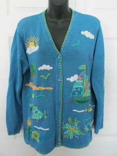 QUACKER FACTORY  Novelty  V-Neck Cardigan Sweater 5 Buttons 55% Ramie / 45% Cotton Blue Size - Large  (Please check approximate measurements below) **** Front and Back Represent: Summer, Sea Shore Fun, Colorful Fish, Sail Boat, Starfish, Tropical Tree    Pre-Owned in Excellent Used Condition   There is some stretch to the material so... Please consider approximate measurements for a comfortable fit.   Measurements taken while garment is lying flat:   side to side under arm = 22" (44" Bust) back Fish Sweater, Tropical Tree, Sea Shore, Sail Boat, Arm Cuff, Colorful Fish, Front Bottoms, V Neck Cardigan, Blue Sweaters