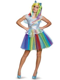 a woman in a rainbow costume posing for the camera with her hands on her hips