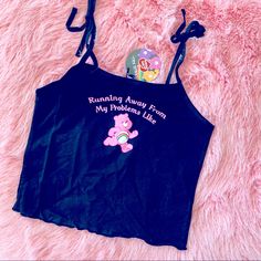 New Care Bears X Dolls Kill Black Tie Shoulder Tank Top. This Is Super Cute! Made Of Black 95% Cotton 5% Spandex. Cheer Bear Front And Center. Perfect For Lounging Or Any Spring/Summer Fit. Pink Sleeveless Kawaii Top, Cute Graphic Print Tank Top, Cute Pink Letter Print Tank Top, Fun Pink Cotton Tank Top, Cute Black Cotton Tank Top, Cute Pink Tank Top, Cheer Bear, Black Tube Top, Cropped Tee Shirt