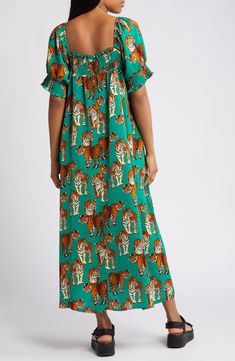 A vibrant and ferocious print emboldens this puff-sleeve maxi designed with shaping smocking at the neckline and cuffs. Slips on over head Square neck Elbow-length sleeves 100% polyester Hand wash, line dry Imported Green Maxi Dress With Gathered Sleeves, Smock Maxi Dress For Daywear, Maxi Dress With Elastic Neckline For Daywear, Maxi Dress With Smocked Cuffs For Daywear, Maxi Length Smocked Dress For Daywear, Maxi Length Dress With Smocked Cuffs For Daywear, Daywear Maxi Dress With Smocked Cuffs, Smock Maxi Dress With Short Sleeves, Vacation Maxi Dress With Gathered Sleeves