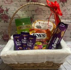 a basket filled with assorted chocolates and candy