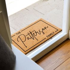 a door mat that says the pattern family on it in front of an open door