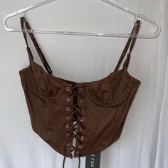 Beautiful Lace Up Bustier By Whitefox Boutique. Never Worn And New W/Tags, Just Did Not Fit Me. Can Adjust Straps, And The Lace Up Front Can Adjust The Sizing As Well. The Back Zippers Up And I Would Say Fits An Extra Small. Brown Fitted Cami Tank Top, Brown Fitted Tank Top, Spring Night Out Brown Tank Top, Brown Tank Top For Night Out In Spring, Brown Fitted Spaghetti Strap Top, Brown Cami Camisole For Night Out, Brown Fitted Top With Spaghetti Straps, Brown Cami For Night Out, Brown Camisole For Night Out