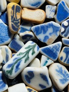 some blue and white rocks with designs on them