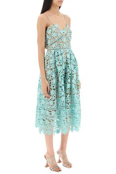 Sacai dress crafted in embroidered floral lace. Characterized by a waisted bodice with scoop V-neck and spaghetti straps, this model boasts a pleated circular skirt, back zipper closure and lined interior. Regular fit with midi length. The model is 177 cm tall and wears size UK 8. Size Info UK Color Detail Light blue Made In China Material 100%PL Season One spring Season Two summer Product clothing Brand Self Portrait Size And Fit A-line Lace Midi Dress For Garden Party, Evening Midi Dress With Delicate Lace, Sweetheart Neckline Lace Dress With Lace Top, Tea-length Scalloped Lace Dress, Lace Midi Dress With Lace Top, Tea Length Scalloped Lace Dress, Scalloped Lace Tea-length Dress, Chic Lace Midi Dress With Lace Bodice, Elegant Dress With Lace Top And Spaghetti Straps