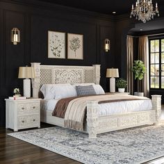 a bed room with a neatly made bed and a chandelier