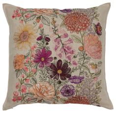 an embroidered pillow with flowers on it