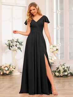 a woman wearing a black bridesmaid dress with thigh high slit and short sleeves