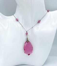 Lovely antique Art Deco silverplated necklace with pink crystal beads and drop.  Measures - 17 inches long, 43.18 cm Drop measures - 1 1/2 x 3/4 inches, 3.81 x 1.91 cm CONDITION: No chips, cracks or other flaws. Great condition. See pictures for details. If you like Art Deco jewelry please take a moment to check out the other wonderful pieces I have for sale. I combine shipping costs for multiple purchases. Pink Formal Jewelry With Faceted Beads, Pink Faceted Beads Jewelry For Formal Occasions, Pink Teardrop Pendant Necklace For Formal Occasions, Silver Drop Necklaces With Faceted Beads, Pink Briolette Necklace For Jewelry Making, Elegant Pink Teardrop Crystal Necklaces, Pink Dangle Necklaces With Gemstones, Elegant Pink Crystal Necklaces With Faceted Beads, Pink Teardrop Sterling Silver Necklace