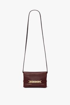 A sophisticated day-to-night option, the Mini Chain Pouch in Burgundy is crafted from supple leather with a sumptuous suede lining. It has a detachable strap for versatile styling as either a shoulder bag or clutch., while the house’s signature gold-tone chain detail adds a striking finishing touch. Victoria Beckham Mini Chain Pouch Bag With Long Strap In Burgundy Leather  - Size Default Title UK Burgundy Bag, Pouch Bag, Bag Straps, Designer Outfits Woman, Victoria Beckham, The House, Bag Lady, Pouch, Shoulder Bag