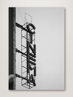 a black and white photo of a building sign