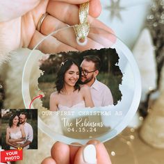 a person holding up a glass ornament with a photo on the front and bottom