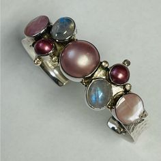 Gorgeous Fusion By Sara Blaine Sterling Silver 18kt Gold Assorted Gemstones Cuff Bracelet. Bracelet Features Pink Pearls, Moonstones, Mop And Tiny Topaz In 18k Gold Setting. Fits Most Sizes. Can Be Adjusted. Stamped 925 18k. Excellent Condition. Elegant Cuff Bracelet With Natural Stones, Formal Sterling Silver Cuff Bracelet, Elegant Natural Stones Cuff Bangle Bracelet, Elegant Natural Stone Cuff Bangle, Elegant Natural Stones Cuff Bracelet, Luxury Natural Stones Bracelets, Elegant Cuff Bracelet With Gemstone Accents, Elegant Silver Multi-stone Cuff Bracelet, Elegant Multi-stone Cuff Bangle Bracelet