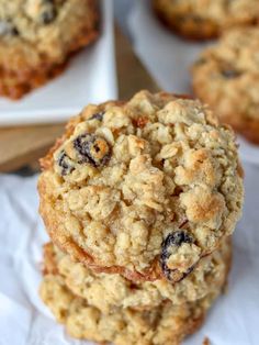 three oatmeal cookies stacked on top of each other with raisins