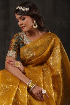 Alluring mustard organza saree is a perfect choice for parties! The saree comes with a designer Kalamkari saree blouse. Disclaimer: The actual product may vary slightly from the image. These are custom orders, hence expect slight variation in color, placement of the motif or buta. ESTIMATED DELIVERYBecause this is a custom order, it would take about 4 weeks from the date of purchase. RETURN POLICYThis product is a custom order and cannot be returned or exchanged. Kalamkari Blouse, Kalamkari Saree, Wedding Sarees, Fashion Journals, Traditional Fabric, Organza Saree, Saree Online, Designer Sarees, Handloom Saree