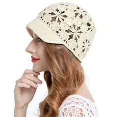 a woman wearing a white crochet hat