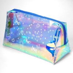 Carry your makeup and other essentials in style! Holographic, graffiti makeup bag provides ample space for travel and everyday. Closure: Zipper Dimensions: 8'' W x 5'' H Material: PU - Claire's Medium Holographic Graffiti Makeup Case - Blue Trendy Rectangular Cosmetic Bag, Trendy Blue Cosmetic Bag For Travel, Trendy Blue Travel Cosmetic Bag, Trendy Blue Rectangular Cosmetic Bag, Blue Rectangular Pencil Case With Zipper, Blue Rectangular Pencil Case With Zipper Closure, Trendy Blue Cosmetic Bag For School, Trendy Blue Cosmetic Bag For Gift, Trendy Blue Pouch Pencil Case