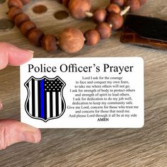 a police officer's prayer is shown with beads and a cross on the table