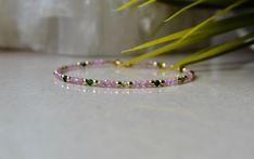 "This delicate gemstone bracelet is made of high quality gemstones - Pink Tourmaline, Watermelon Tourmaline (green beads) and Gold Hematite. This bracelet is ultra-delicate and dainty, it would be a great gift for beautiful yourself or for a person who needs to feel it. Pink Tourmaline gives a person inner light, which attracts benevolent people and joyful events. The stone also helps its owner to fight unreasonable fears and self-doubt. . ❗️Sign up to our Newsletter and get 15% OFF your order ( Pink Faceted Beaded Bracelet As A Gift, Pink Faceted Beaded Bracelets As A Gift, Pink Faceted Bracelets As Gift, Delicate Pink Round Bracelets, Dainty Pink Beaded Bracelets With Gemstone Beads, Dainty Pink Bracelets With Gemstone Beads, Dainty Pink Gemstone Bead Bracelets, Dainty Pink Bracelet With Natural Stones, Dainty Pink Gemstone Beads Bracelet