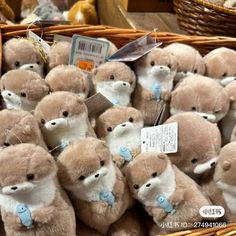 a basket full of teddy bears with tags on them