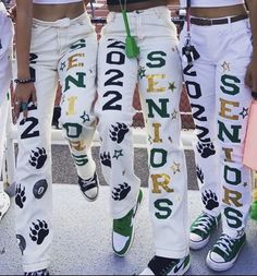 School Spirt Pants Ideas, Football Game Pants Painted, Spirit Day Pants Ideas, Green And Gold School Spirit Outfit, Senior Week Pants, Class Of 23 Senior Pants, Class Of 2023 Senior Pants, Homecoming School Spirit Outfits, Senior Jeans Green And White