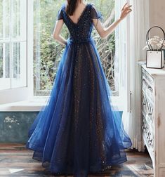 Material: Tulle Color:Navy Blue Hemline:Floor Length  Back Details:Lace-up Dress Number: #G2WS Delivery times: Processing time:    2-3 weeksShipping time:       3-5 working days Rush Order is available, for rush order, the processsing time is only 7-12 working days. Custom Measurements For custom size, please leave us Fitted Blue Tulle Ball Gown, Blue A-line Dress For Prom, Blue A-line Ball Gown For Formal Occasions, Fitted Royal Blue Ball Gown For Evening, Fitted Royal Blue Tulle Evening Dress, Royal Blue A-line Evening Dress For Prom, Blue A-line Evening Dress For Banquet, Fitted Blue Ball Gown With Tulle Skirt, Blue A-line Silhouette Evening Dress