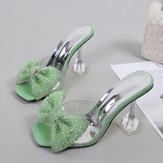 Size 34-46 Summer Party Slippers Fashion Green Rhinestone Bow Heels Sandals Women Square Open Toe PVC Transparent Shoes Slides Shoes Type: Modern Slippers Applicable Place: Outside Upper Material: PVC Heel Height: Super High (8cm-up) Origin: Mainland China CN: Guangdong Season: Summer Heel Type: Spike Heels Item Type: Slippers Model Number: 3256803487271597 Fashion Element: Butterfly-knot Department Name: Adult Outsole Material: Rubber With Platforms: Yes Platform Height: 0-3cm Style: Novelty Insole Material: PU Pattern Type: Solid Fit: Fits true to size, take your normal size Lining Material: NONE womens slippers: summer slippers transparent sandals women: transparent heels High heels slippers Welcome to my shopsize 35=US size 4 = feet lenght 22.5CMsize 36=US size 5 = feet lenght 23CMsize Green High Heel Sandals For Party, Green High Heel Party Sandals, Sparkling Synthetic Heels For Summer, Summer Sparkling Synthetic Heels, Elegant Green Sandals For Party, Green Pointed Toe Sandals For Party, Green Pointed Toe Party Sandals, Green Synthetic Heels For Party, Green Open Toe Heels For Party