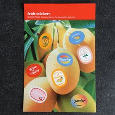 an advertisement for fruit stickers on a table