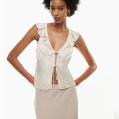 Aritzia Tonka Satin Blouse, Never Been Worn In The Color “Light Birch” Elegant Sleeveless Summer Blouse, Silk V-neck Top For Vacation, Feminine Sleeveless Blouse For Brunch, Elegant Sleeveless Blouse For Brunch, Feminine Sleeveless Blouse For Day Out, Elegant Sleeveless Blouse For Day Out, Feminine Viscose V-neck Blouse, Feminine Silk V-neck Top, Silk V-neck Tops For Spring