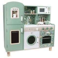 a toy kitchen set with green and white colors on the cabinets, stove top oven and microwave