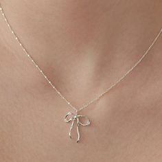 Sterling Silver Bow Necklace, Sparkling Crystal Bow Charm Necklace, Bow Jewelry, Silver Necklace, Perfect Gift for Her (NZ2182) ▶ Product Info. - Material: 925 Sterling Silver / Cubic Zirconia - Metal Finish: 14K Gold / Silver + Anti-Tarnish E-Coat  - Safety: Nickle & Lead free and Hypoallergenic - Dimensions: Pendant - 17.4mm x 21mm w/width 3.2mm / Cubic Zirconia - 3.5mm - Length: 40cm + 3.5cm (length adjustable) - Weight: 3g - TATIANA & Silver 925 engraved tag was added. - Made In South Korea Girly Jewelry Silver, Silver Necklace Party Gift, Silver Necklace For Party Or As A Gift, Silver Necklace For Party Or Gift, Silver Necklace For Party And Gift, Elegant Silver Necklace For Gift, Elegant Silver Charm Necklaces, Elegant Pendant Charm Necklaces, Elegant Sterling Silver Necklaces For Gifts