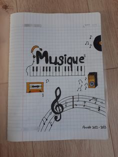 an open notebook with music notes and musical symbols