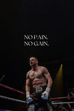 a man standing in the middle of a boxing ring with no pain, no gain