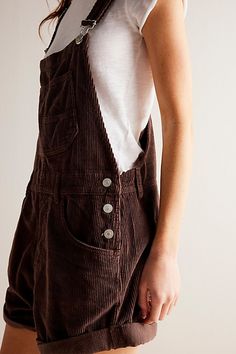 A shortened, textured version of our favorite Ziggy Overalls! **Fit:** Classic bib-and-brace silhouette with relaxed fit **Features:** Functional bib pocket, rolled hemlines, side button closures, adjustable brace straps, ultra-soft corduroy fabrication **Why We | We The Free Ziggy Cord Shortalls at Free People in Brown, Size: L Ziggy Overalls, Corduroy Jumpsuit, Denim Maxi Skirt, Barnwood, Bottom Clothes, Boho Outfits, Long Tops, Short Tops, Jumpsuit Dress