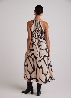 This stunning print maxi dress features a pleated halter design with a unique mosaic print, creating a flowy and fun look that is sure to turn heads. Fall in love with the elegant pleats that add a touch of sophistication to this versatile dress, which can be styled with either boots or sandals for a chic and stylish ensemble. SIZE CHEST SHOULDER TO HEM XS 36" 46" S 38" 47" M 40" 48" L 42" 49" Pleated Halter Dress, Knife Pleat, Short Loungewear, Bella Dahl, Maxi Dress Sale, Essential Dress, Halter Maxi Dress, Halter Maxi, Halter Maxi Dresses