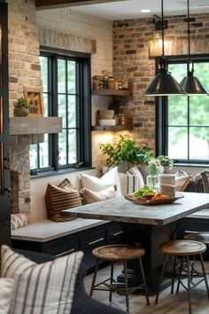 an open kitchen and living room with brick walls