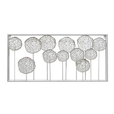 a metal wall sculpture with white flowers on it's sides and four petals in the middle