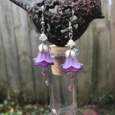 Purple flower earrings with crystals hanging Crystals Hanging, Purple Drop Earrings, Earrings With Crystals, Floral Hair Combs, Silver Heart Earrings, Iridescent Crystal, Spike Earrings, Green Quartz, Quartz Earrings