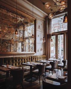 an empty restaurant with tables and chairs