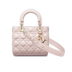 The Lady Dior My ABCDior bag epitomizes the House's vision of elegance and beauty. Sleek and refined, the timeless yet modern style is crafted in powder pink lambskin with Cannage stitching, creating the instantly recognizable quilted texture, while the pale gold-finish metal 'D.I.O.R.' charms further embellish its silhouette. Featuring a shoulder strap that can be customized by adDiorried by hand, over the shoulder or crossbody. Wide, adjustable and customizable shoulder strap with three pins included. The shoulder strap can accommodate up to six pins in total. Interior zip pocket and patch pocket The bag may be paired with Diorent embroidered straps Dust bag included Made in Italy Delivery 5-8 or 10-15 working days Please note that during high season and Sale period, delivery times may b Lady Dior My Abcdior Bag, Dior And I, Christian Dior Fashion, Small Lady, Bag Women Fashion, Christian Dior Couture, Dior Fashion, Dior Couture, Powder Pink