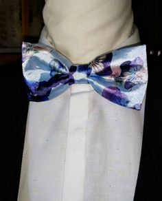 "Stunning and classic bow tie has been design in exotic, bright satin prints. The Unisex bow ties are an excellent evening addition to any wardrobe. You will look unique at any special occasion. Our bow ties are made in fine satin with interfacing to give it, stability and shape. Approximate Measurements: Bow: 5\" x 2.5\" Adjustable Strap: 14\" x 19\" Bow Tie care recommended Dry Clean only. All items are sent Via USPS First Class Mail within the U.S. shipping times take an average of 5-7 Busine Fitted Purple Suit And Tie Accessories For Party, Purple Fitted Suit And Tie Accessories For Groom, Satin Bow Tie As Gift, Blue Satin Bow Tie For Weddings, Blue Bow Ties For Wedding, Purple Bow Tie For Party, Blue Satin Bow Ties For Wedding, Blue Wedding Ties With Decorative Bow, Purple Party Bow Tie