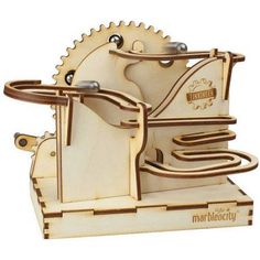 a wooden model of a machine with gears on it's sides and the words marboccy written in gold