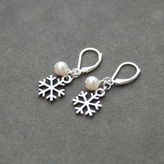 Sterling Silver Snowflake Earrings Pearl by SprigJewelry on Etsy Elegant White Earrings For Holiday, Elegant Nickel-free Jewelry For Holiday, Silver Jewelry With Matching Earrings For Christmas, Elegant White Holiday Earrings, Elegant White Jewelry For Holiday, Elegant White Holiday Jewelry, Elegant Festive Jewelry For Winter, Elegant White Jewelry For Christmas, Christmas Anniversary Jewelry With Matching Earrings