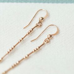 "🔥Subscribe to receive 10% off your first order: https://mailchi.mp/678214ad2c78/casouls Nothing says unique like a personalized earring. Bold enough to make a point, but small enough to be dainty. Perfectly designed to create the balance of movement with your personal message. * Thea drop-earrings feature a customizable message in Morse code on each earring. * Morse code messages are made up of Japanese seed beads. * Available in sterling silver and 14k gold filled. * Custom-to-order and handm Mother's Day Rose Gold Dangle Earrings, Gift Dangle Linear Earrings With Lever Back, Gift Linear Dangle Earrings With Lever Back, Hypoallergenic Dangle Earrings For Mother's Day, Gift Long Drop Linear Earrings With Ear Wire, Gift Drop Linear Earrings With Ear Wire, Linear Drop Earrings With Ear Wire For Gift, Rose Gold Linear Earrings For Pierced Ears As Gift, Rose Gold Dangle Linear Earrings As Gift