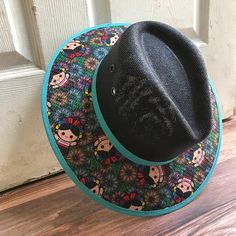 This beautiful Mexican Sombrero has would be perfect to add that special touch to any outfit. MADE IN MEXICO By: Mexican Artisans For: Women Size: Medium 23' Color: black | multi Details: Material: palm straw Fabric canvas design Bottom black suede Inner elastic band Contact us for more details PLEASE READ BEFORE PURCHASE: The picture is an ACCURATE REPRESENTATION.Colors in the pictures may vary a little by effects of light. Each product is handmade from Mexico causing differentiation and minor Black Bohemian Straw Hat For Summer, Black Brimmed Toquilla Straw Hat, Black Brimmed Woven Panama Hat, Black Bohemian Sun Hat For Vacation, Black Woven Brimmed Panama Hat, Black Woven Panama Hat With Short Brim, Black Woven Panama Hat With Flat Brim, Black Woven Fedora Hat, Black Woven Flat Brim Panama Hat